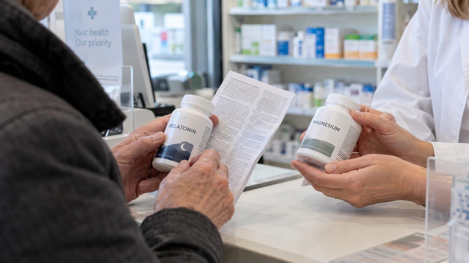 Generated scene of an adult reviewing two unbranded supplement labels with a pharmacist